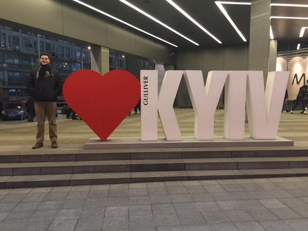 Josh DeMoss with "I Heart Kyiv" sign.