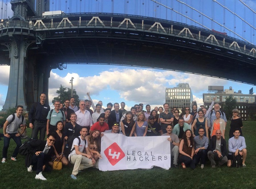 Group shot in front of bridge